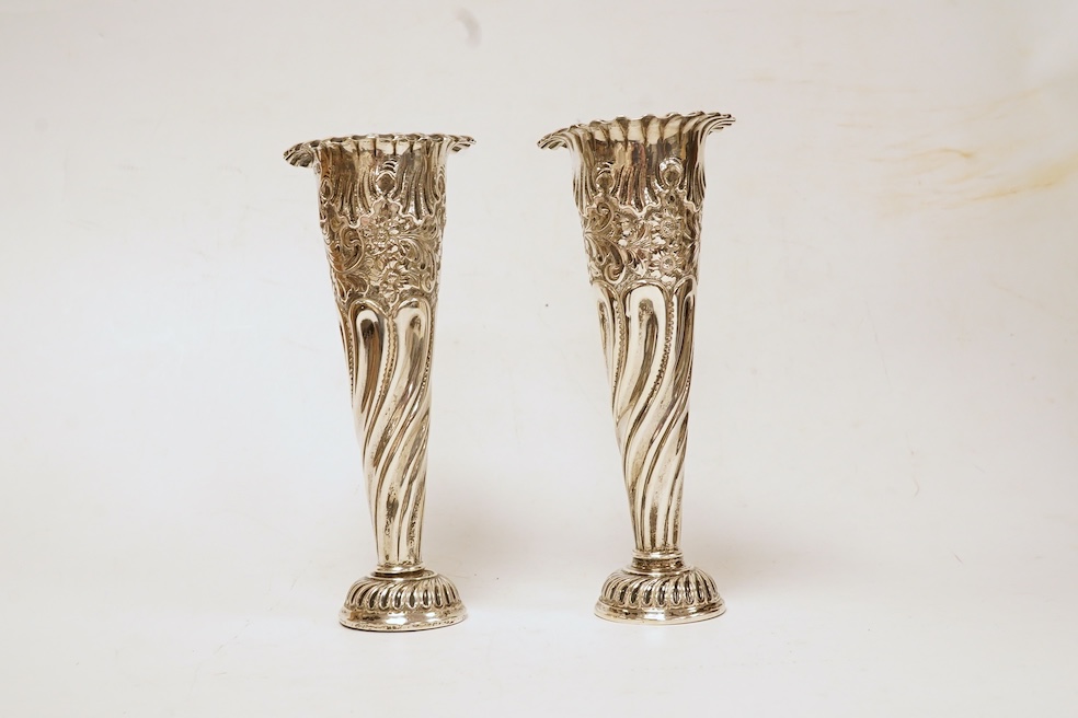 A pair of Edwardian silver spill vases, by S.W. Smith & Co, London, 1905, height 16.1cm, weighted, one split. Condition - poor